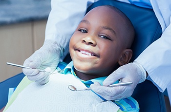 Child smiling at dental checkup
