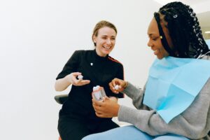 Dentist discussing dental crown with a female patient