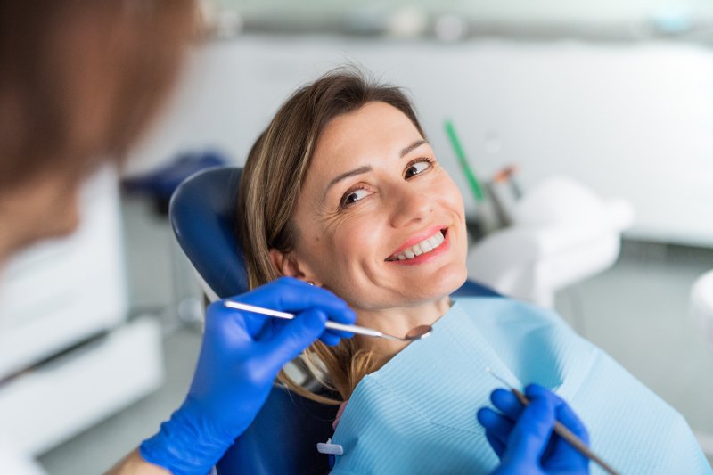 A woman receiving a dental checkup early in the year