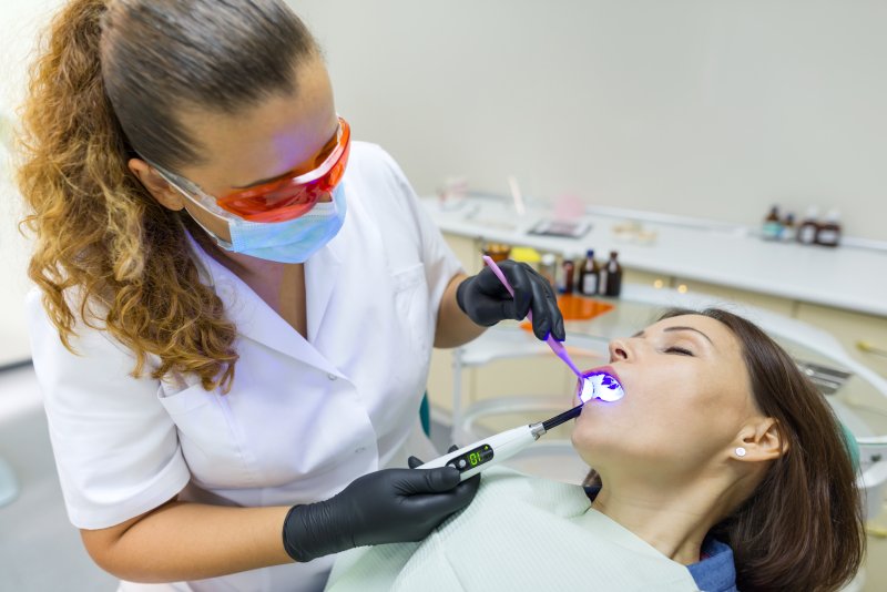 woman under dental sedation at the dentist’s office